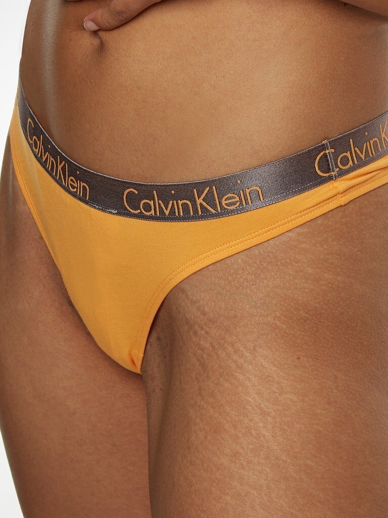 Naiste stringid Calvin Klein THONG, oranž 000QD3539E SF6 45142 hind ja info | Naiste aluspüksid | kaup24.ee