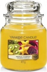 Ароматическая свеча Yankee Candle Tropical Starfruit 411 г цена и информация | Подсвечники, свечи | kaup24.ee